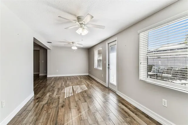 a bathroom with a granite countertop double vanity sink and a mirror