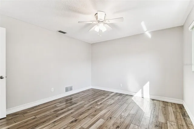 an aerial view of residential houses with city view
