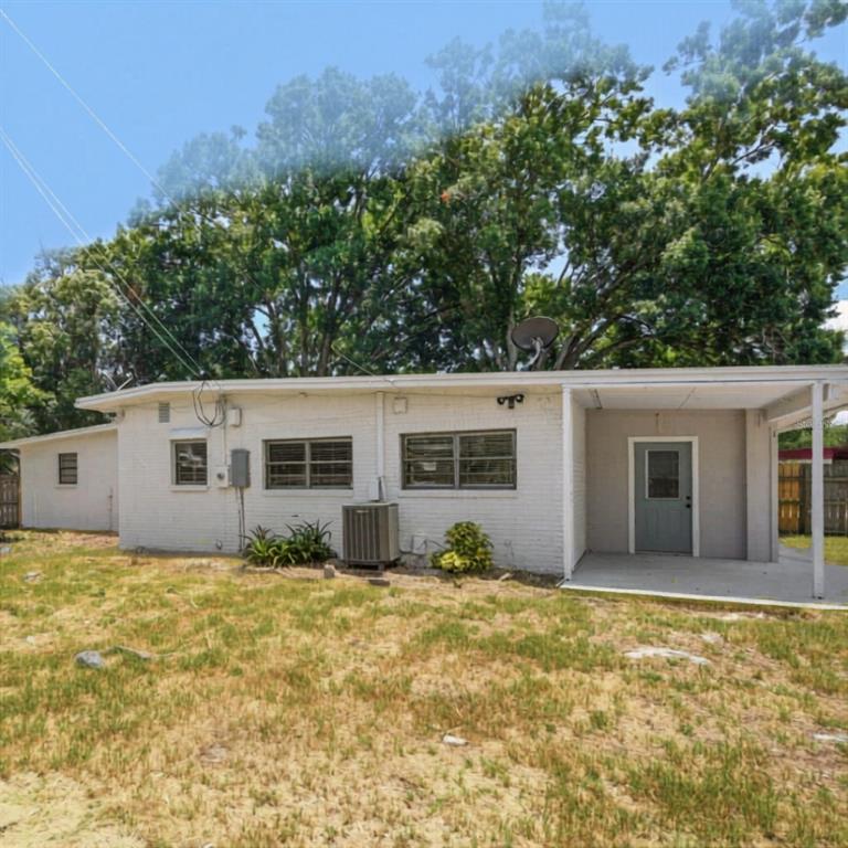 1202 Princeton Road Cocoa, FL 32922 - Photo 2 of 15 a house that has a tree in front of it