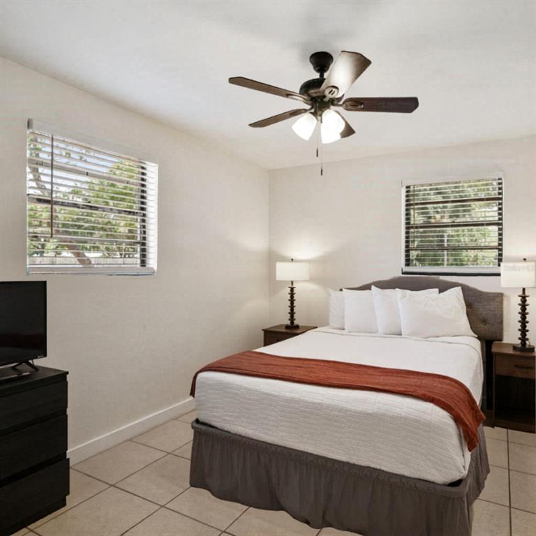 1202 Princeton Road Cocoa, FL 32922 - Photo 5 of 15 a bedroom with a bed and a window