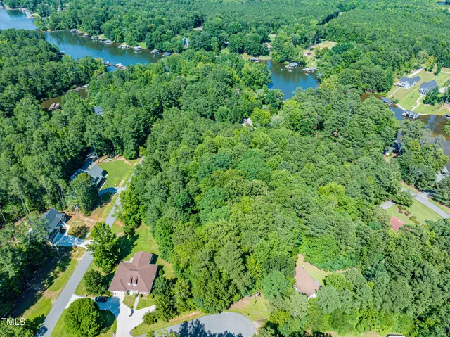 an aerial view of a house with a yard and outdoor space