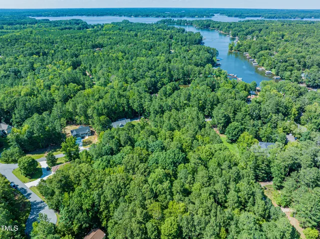 a view of backyard with swimming pool and outdoor seating