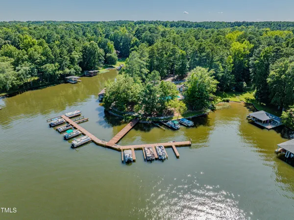 an aerial view of a house with a lake view