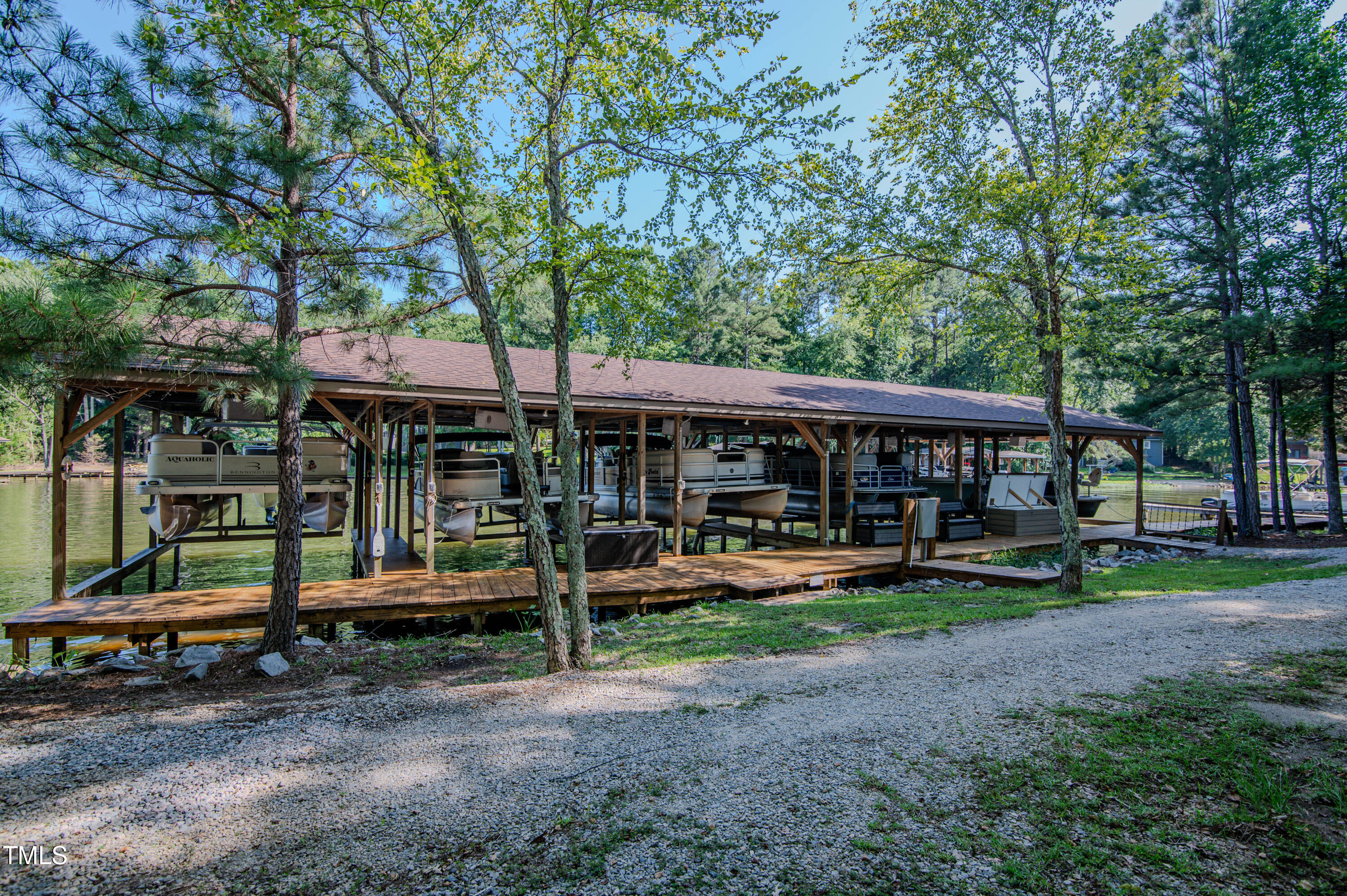 Lot 6 Rabbit Bottom Circle Littleton, NC 27850 - Photo 32 of 39 a view of patio with a table and chairs under an umbrella
