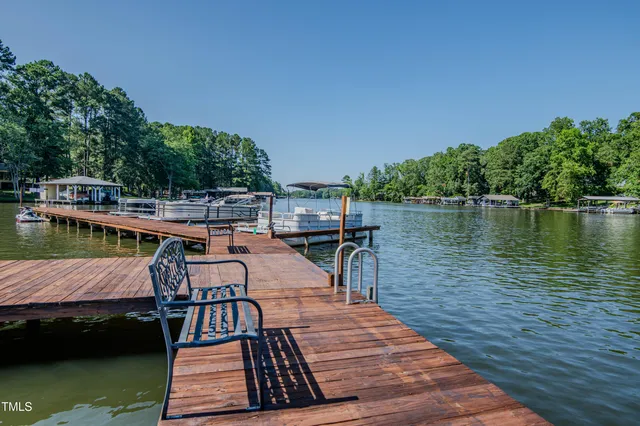 a view of yard with swimming pool and green space
