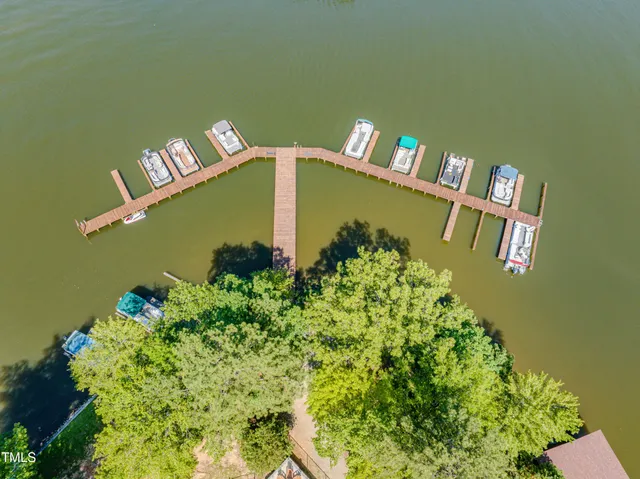 a view of patio with table and chairs under an umbrella