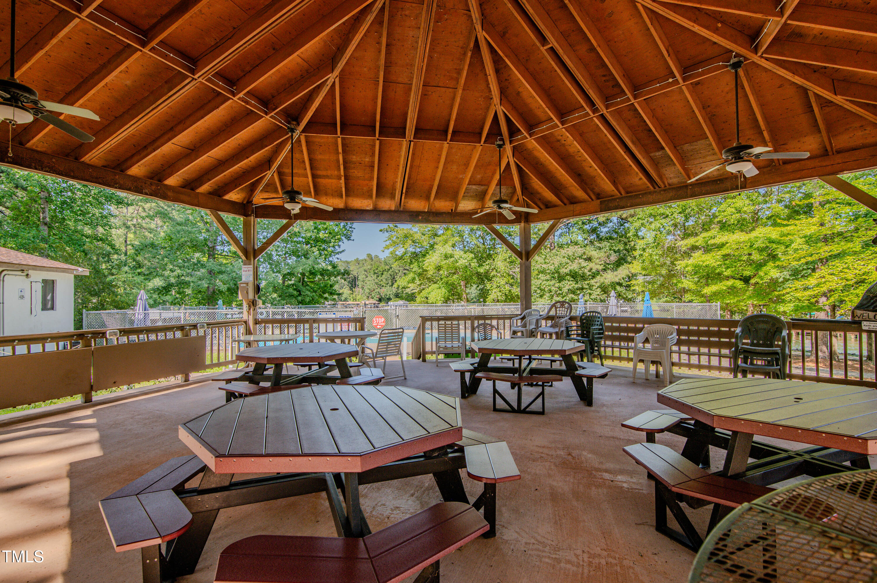Lot 6 Rabbit Bottom Circle Littleton, NC 27850 - Photo 10 of 39 a view of patio with table and chairs under an umbrella