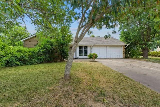 a house view with a garden space