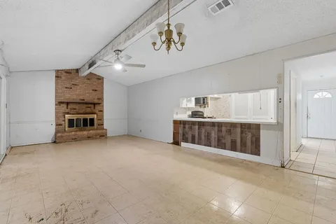 a kitchen with a stove and a refrigerator