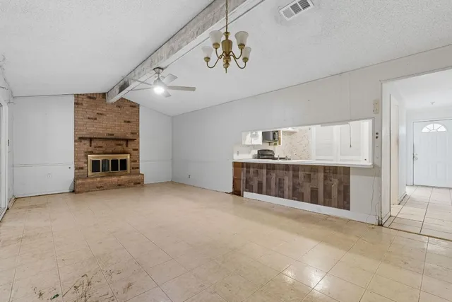 a kitchen with a stove and a refrigerator