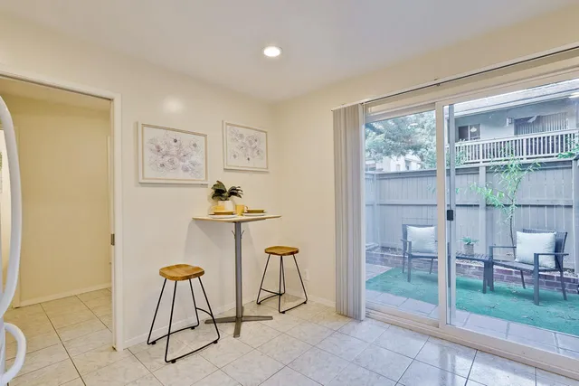 a view of a livingroom with furniture and a gate