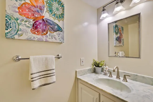 a view of a chairs and table in backyard of the house
