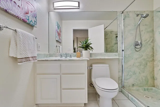 a bedroom with furniture and a fireplace