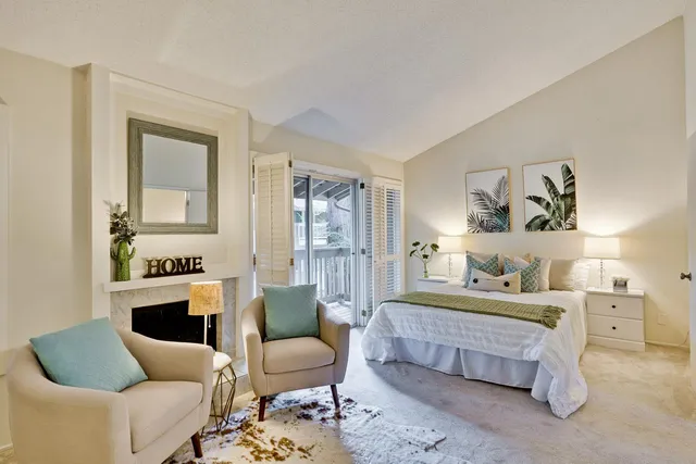 a bedroom with furniture and a wooden floor