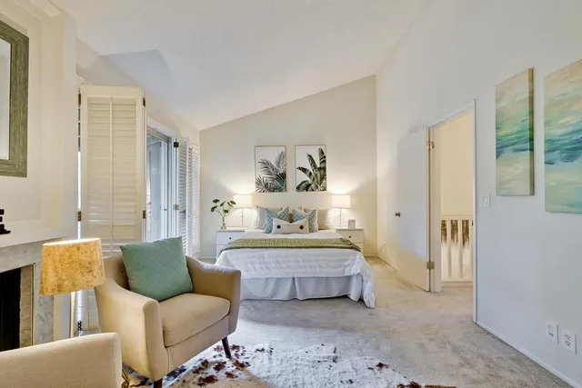 a bedroom with furniture and a window