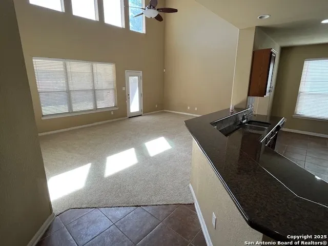 a bathroom with a double vanity sink a mirror and a bathtub