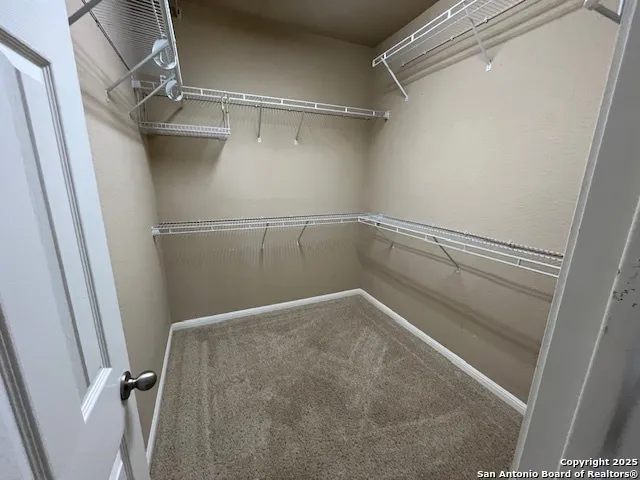 a front view of a house with a yard outdoor seating and garage