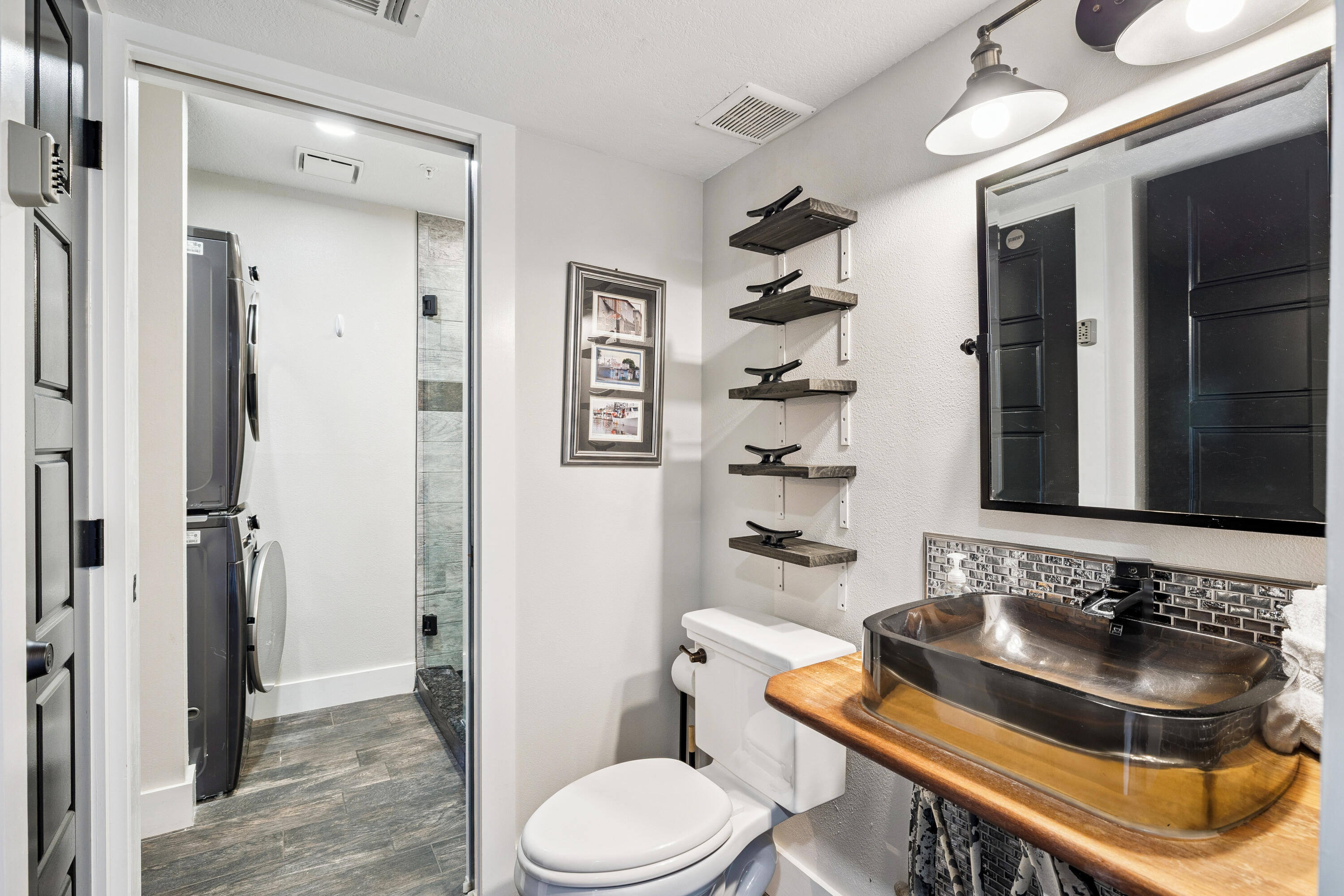 3184 East Scenic Highway 98, Unit 116A Destin, FL 32541 - Photo 12 of 29 a bathroom with a sink and toilet