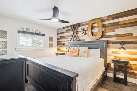 a bedroom with a bed and window