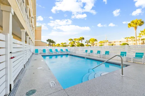 a view of a swimming pool with a lounge chair