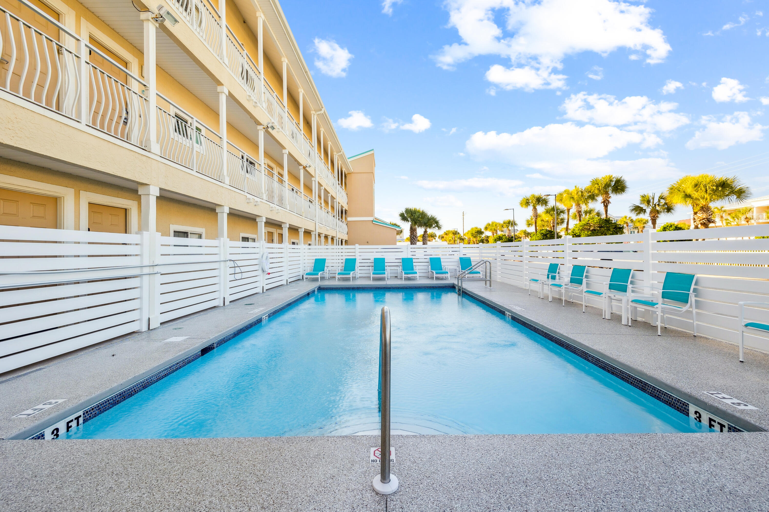 3184 East Scenic Highway 98, Unit 116A Destin, FL 32541 - Photo 21 of 29 a view of a swimming pool with a lounge chair