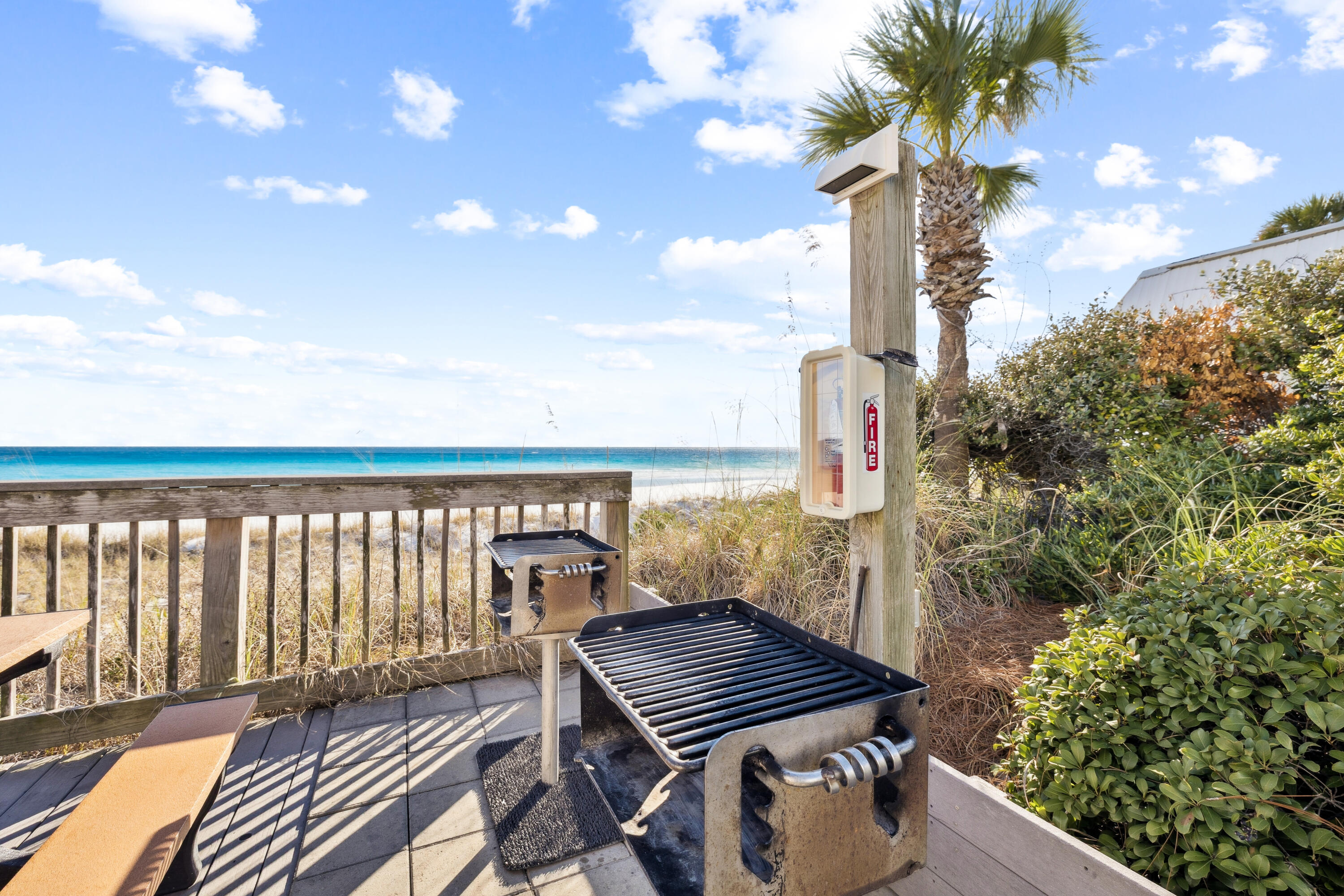 3184 East Scenic Highway 98, Unit 116A Destin, FL 32541 - Photo 24 of 29 a view of a balcony with wooden floor and fence