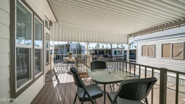 a view of living room kitchen and entryway