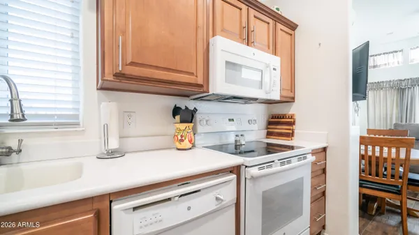 a kitchen with appliances cabinets and a sink