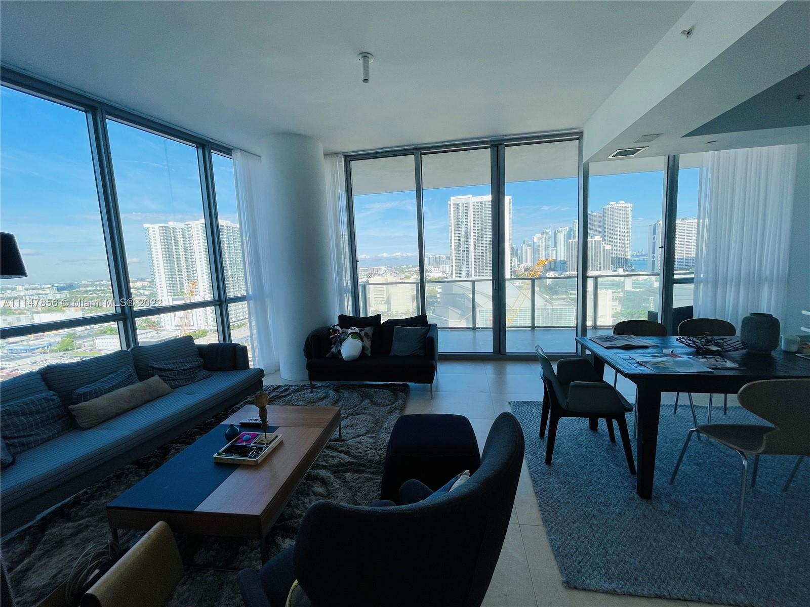 1100 Biscayne Boulevard, Unit 2003 Miami, FL 33132 - Photo 2 of 24 a living room with furniture and a window