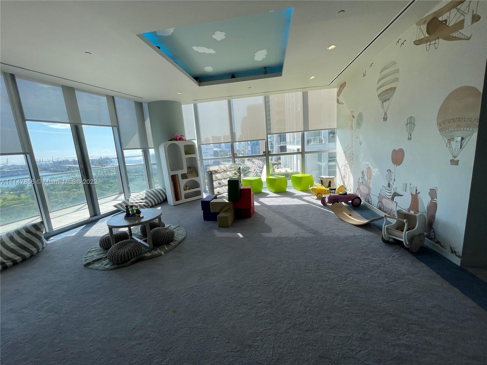 1100 Biscayne Boulevard, Unit 2003 Miami, FL 33132 - Photo 22 of 24 a view of a room with gym equipment