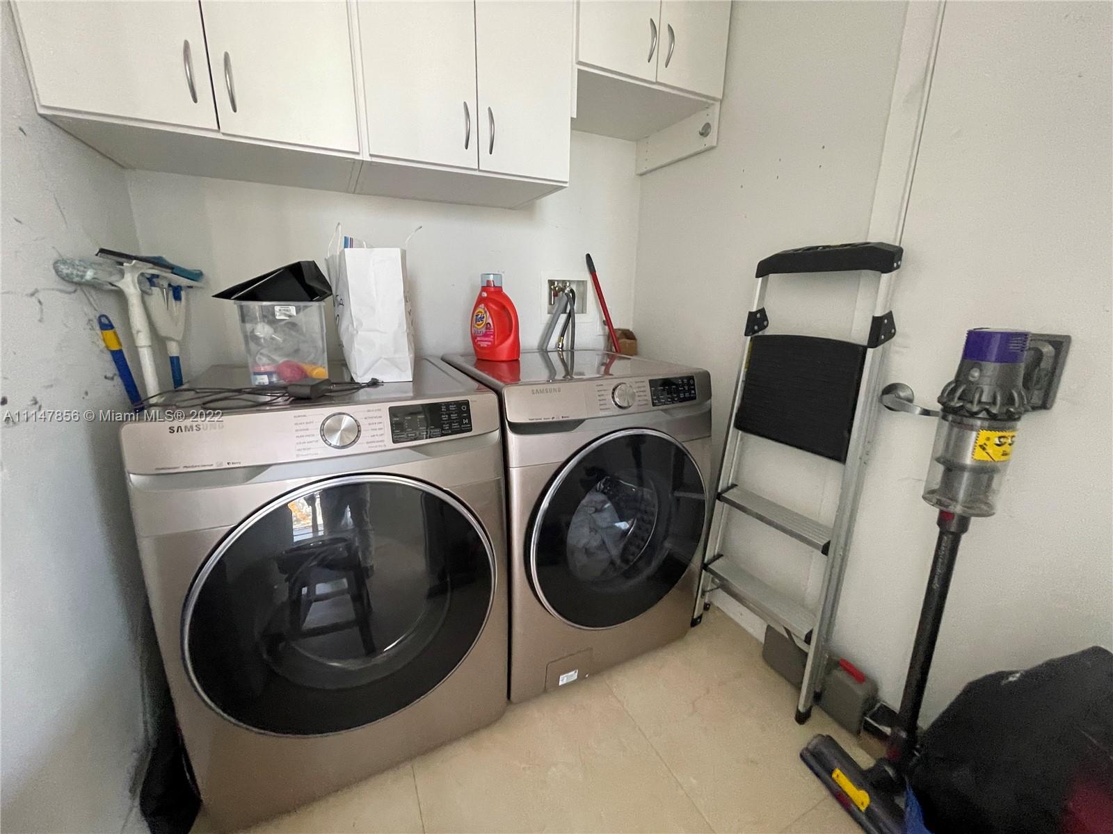 1100 Biscayne Boulevard, Unit 2003 Miami, FL 33132 - Photo 9 of 24 a utility room with dryer and washer