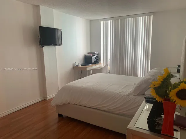 a bathroom with a sink mirror and toilet