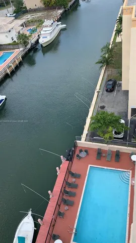 a view of a swimming pool with lounge chair