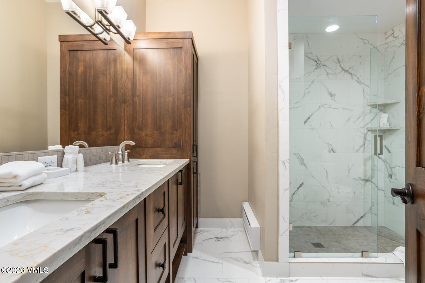 280 Gopher Road, Unit C9 Eagle-Vail, CO 81620 - Photo 16 of 27 a bathroom with a granite countertop sink and a mirror