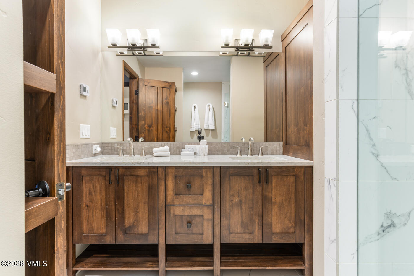 280 Gopher Road, Unit C9 Eagle-Vail, CO 81620 - Photo 17 of 27 a bathroom with a double vanity sink and a mirror