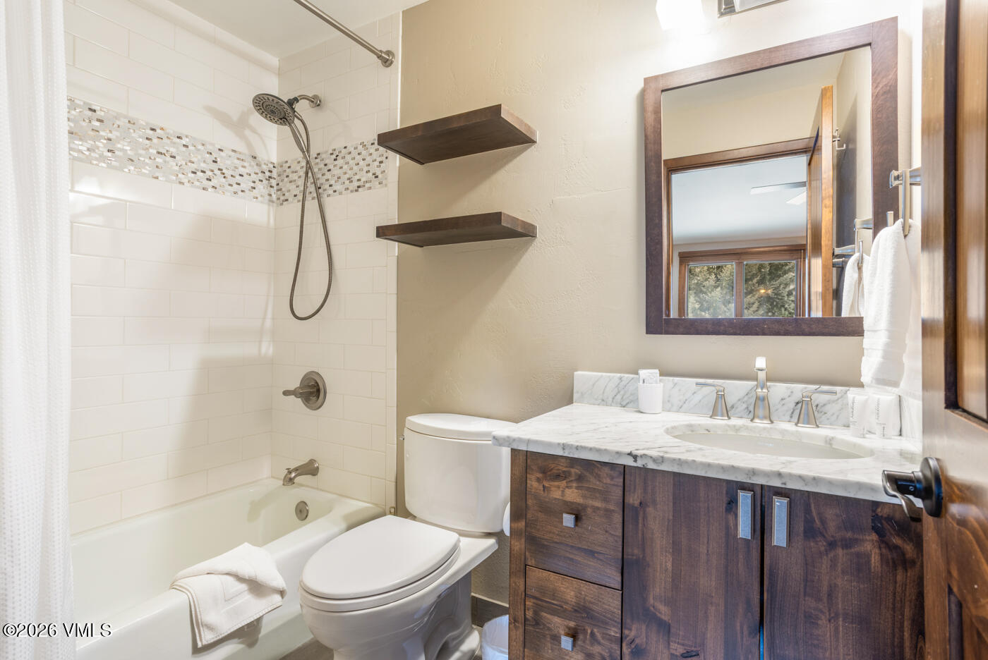 280 Gopher Road, Unit C9 Eagle-Vail, CO 81620 - Photo 20 of 27 a bathroom with a granite countertop sink toilet and shower