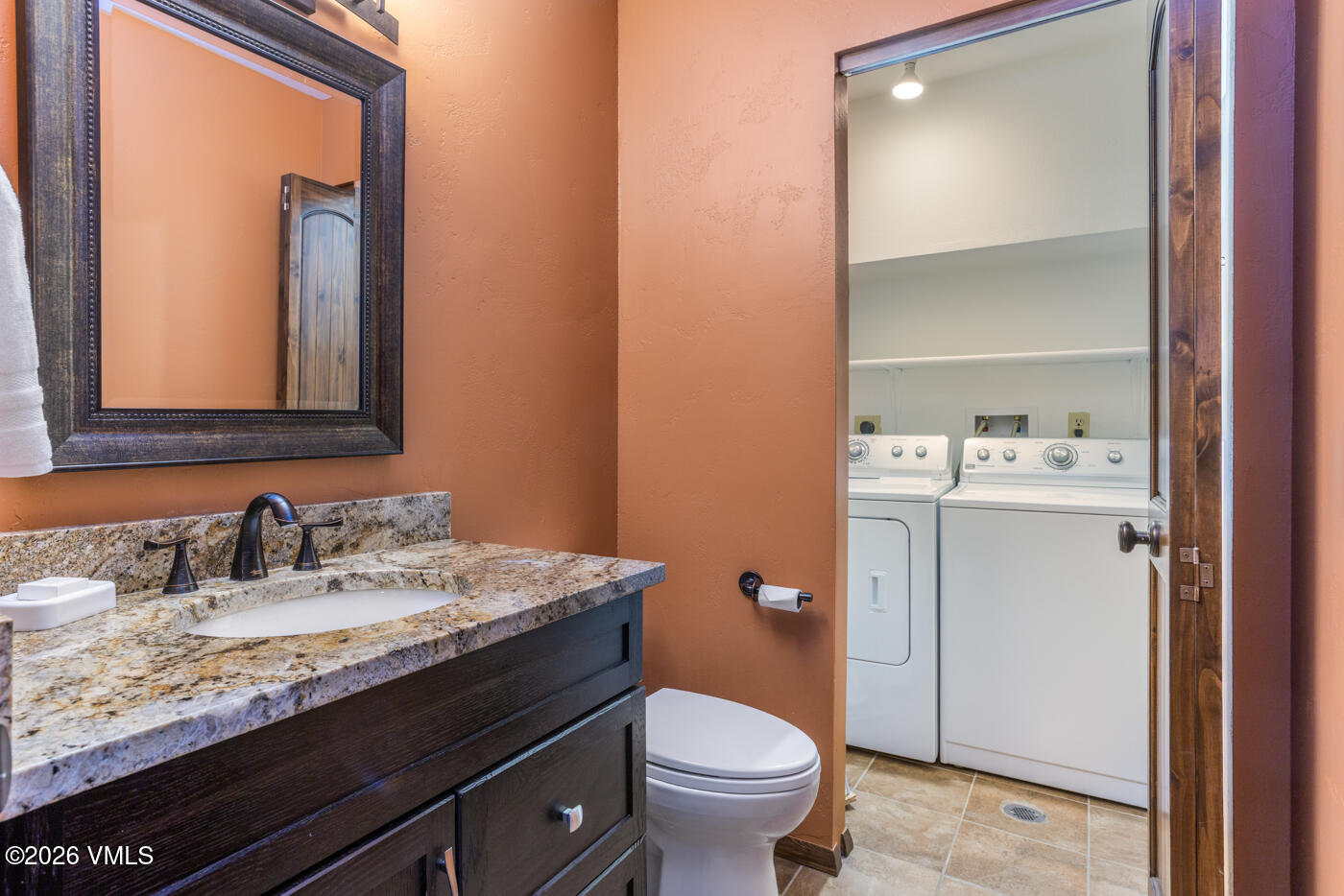 280 Gopher Road, Unit C9 Eagle-Vail, CO 81620 - Photo 21 of 27 a bathroom with a granite countertop sink toilet and mirror
