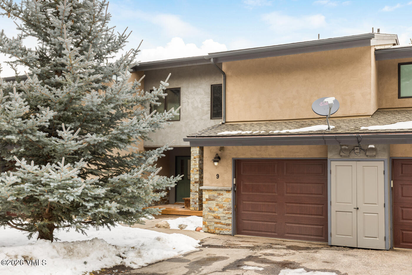 280 Gopher Road, Unit C9 Eagle-Vail, CO 81620 - Photo 26 of 27 a front view of a house with a yard