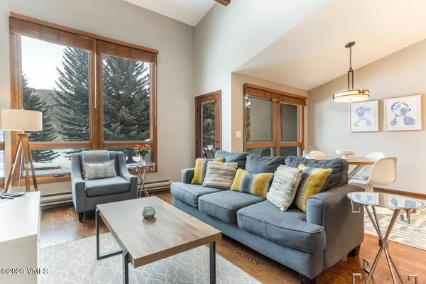 a living room with furniture and a large window