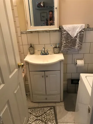 a bathroom with a sink and toilet