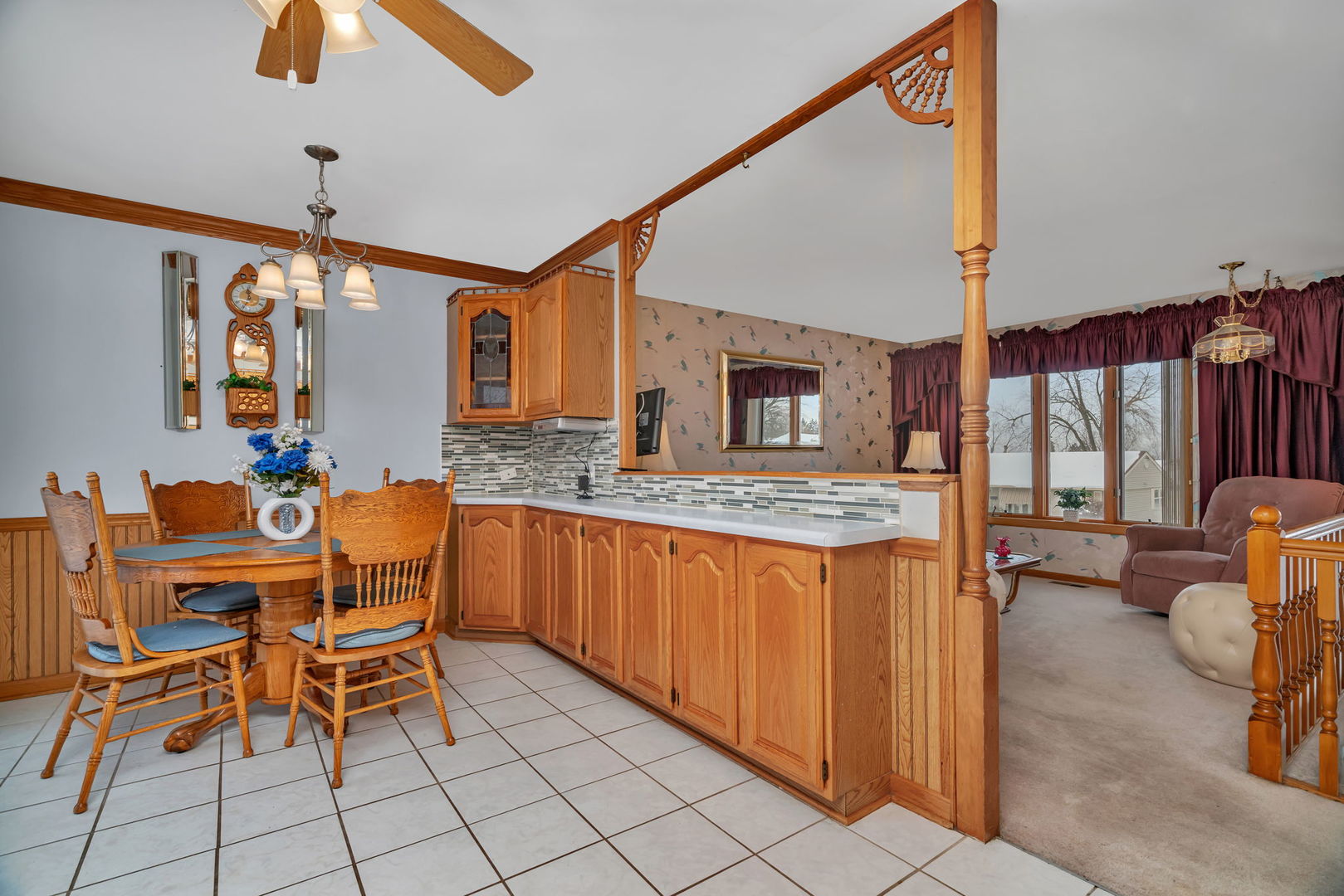 334 Hemlock Avenue Romeoville, IL 60446 - Photo 5 of 24 a dining hall with stainless steel appliances kitchen island granite countertop furniture a rug and a window