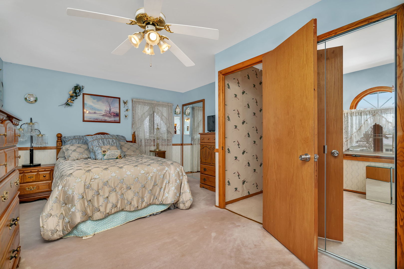 334 Hemlock Avenue Romeoville, IL 60446 - Photo 9 of 24 a bedroom with a bed and a chandelier