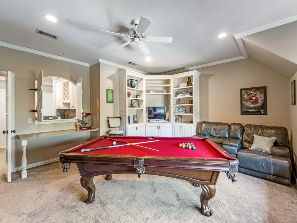 631 Deforest Court Coppell, TX 75019 - Photo 18 of 40 Gameroom has serving bar and window through to the upstairs kitchenette bar - a great place for entertaining.