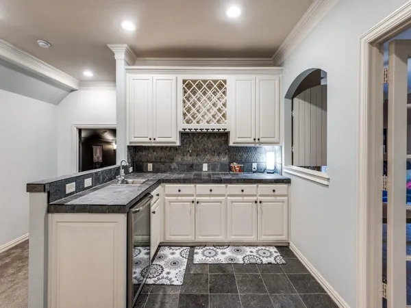 a kitchen with stainless steel appliances granite countertop a sink stove and cabinets