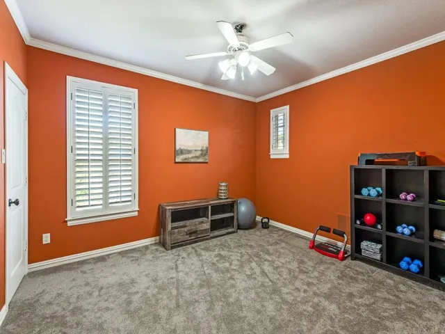 a bedroom with bed and a chandelier