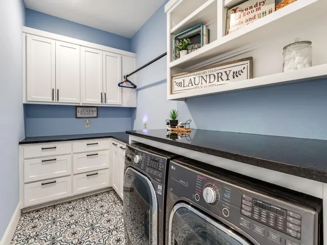 a kitchen with stainless steel appliances granite countertop a sink and a cabinets