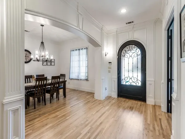 a view of a livingroom kitchen and dining room with wooden floor