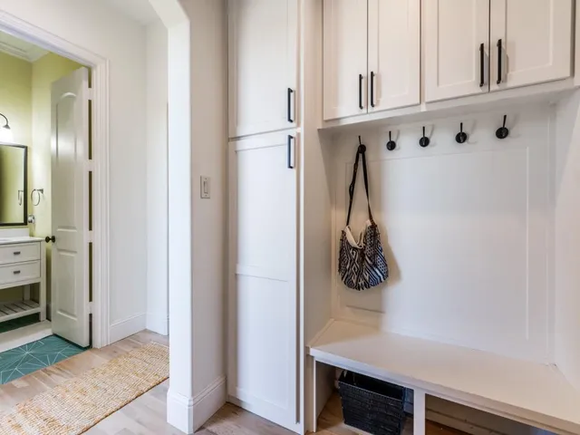 a view of an entryway with wooden floor