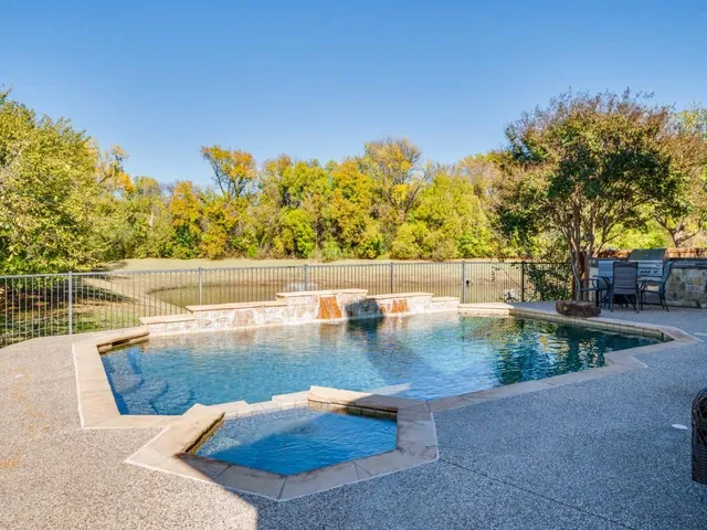 a view of swimming pool with seating