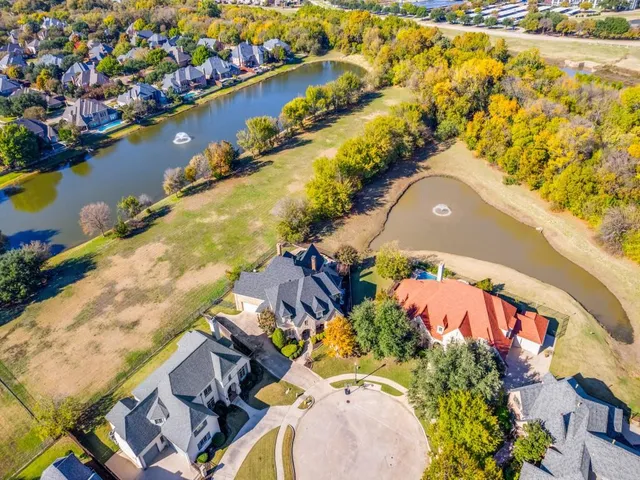 an aerial view of a house with a ocean view